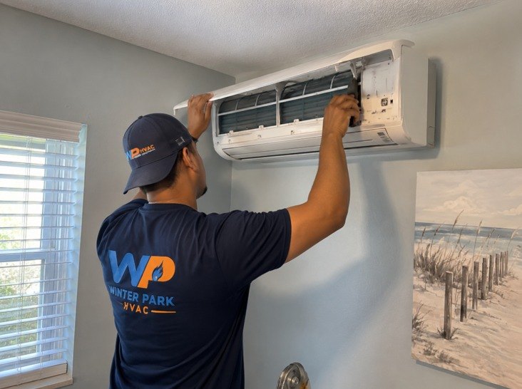 Winter Park HVAC technician servicing a mini split system